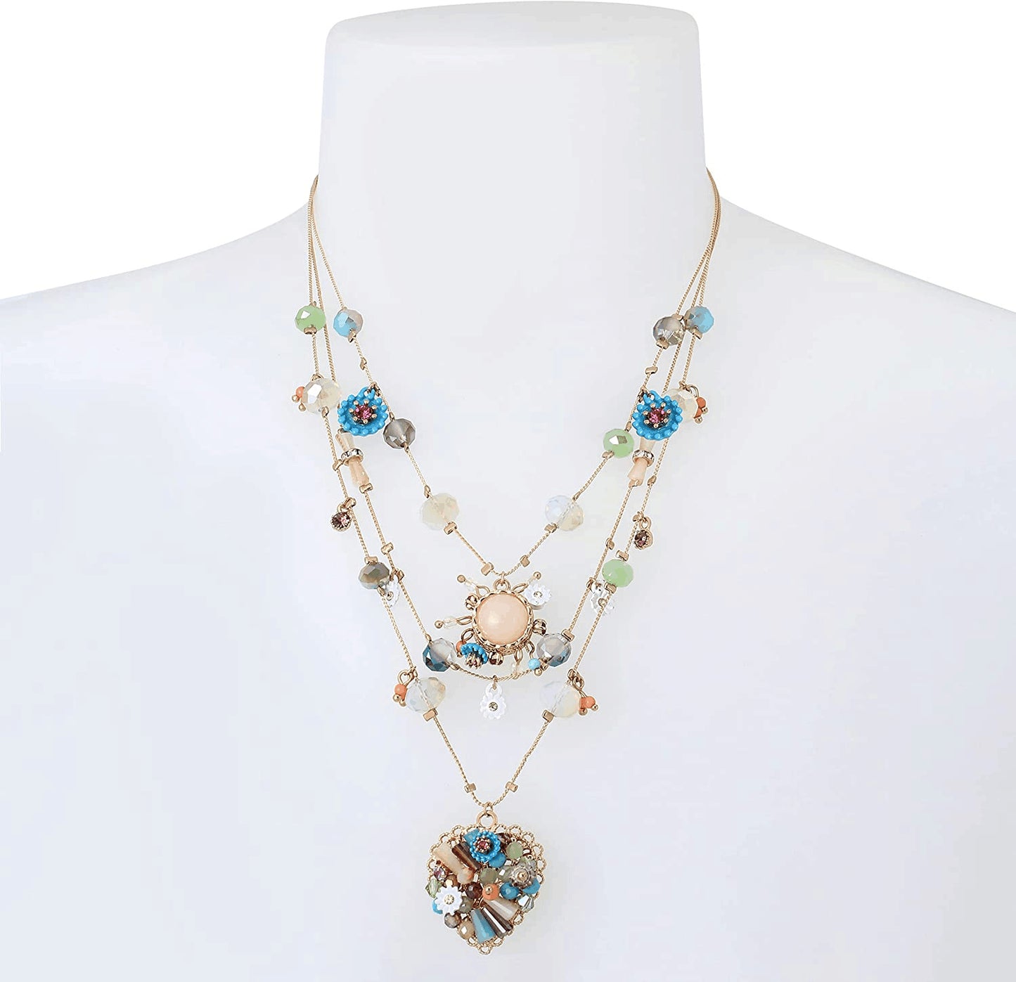 Multistrand necklace with colorful beads and heart-shaped pendant on a mannequin from Nested Wisdom