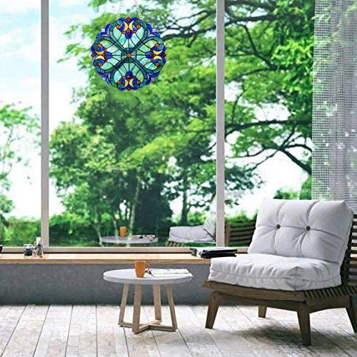 Decorative stained glass window decal on a glass door with outdoor furniture and greenery.
