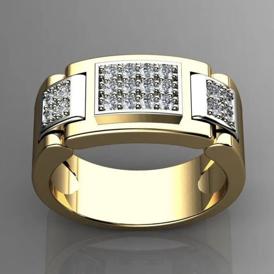 Gold ring with diamond accents on a gray background