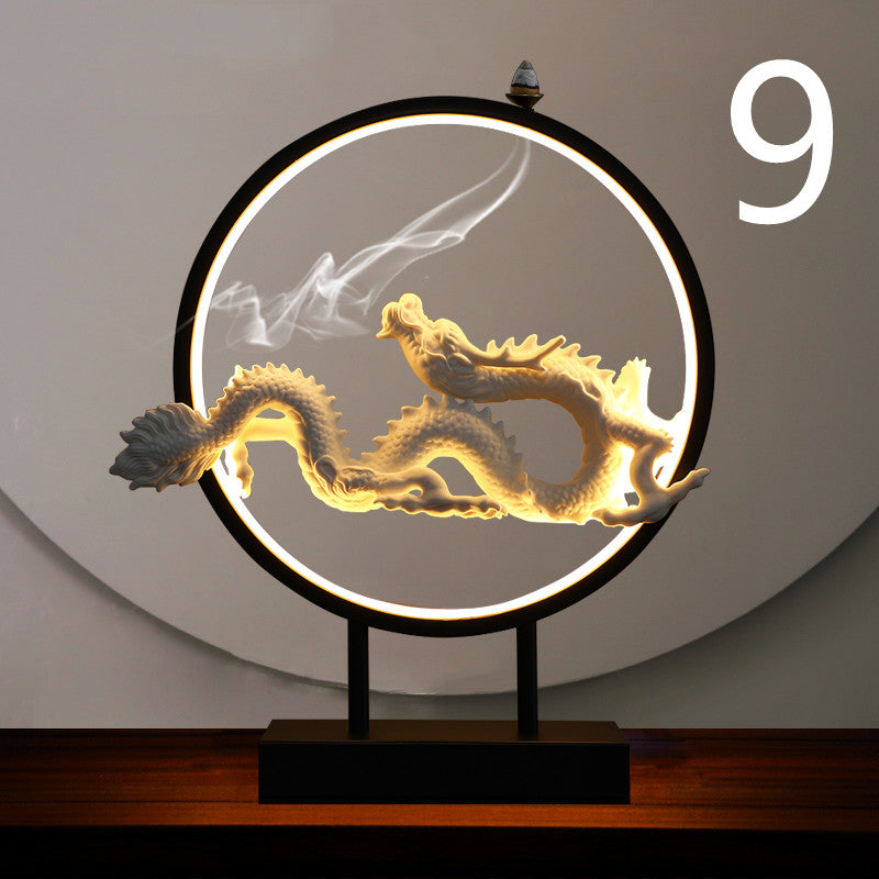 Decorative lamp with a dragon design on a wooden base against a neutral background incense burner