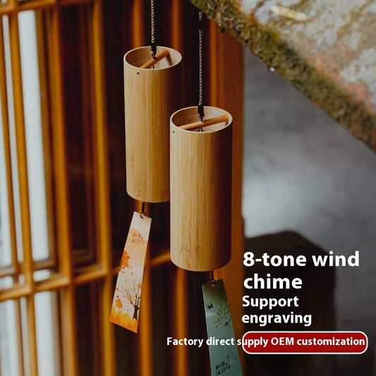 Two wooden wind chimes hanging against a blurred background with text about customization options.