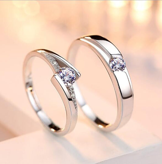 Two silver rings with gemstones on a soft, blurred background
