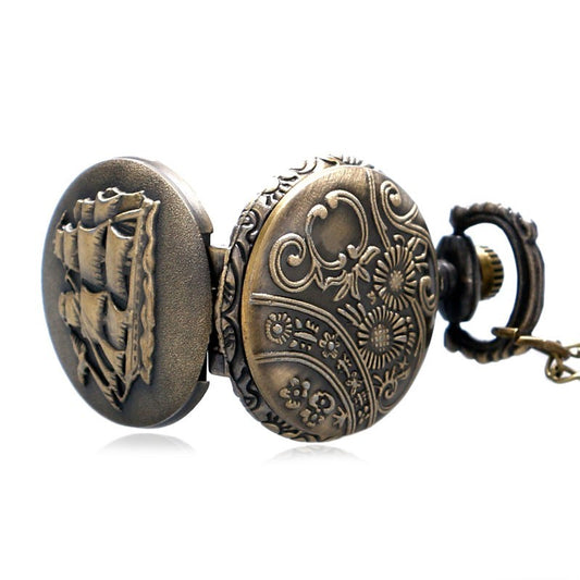 Bronze pocket watch with intricate designs on a white background