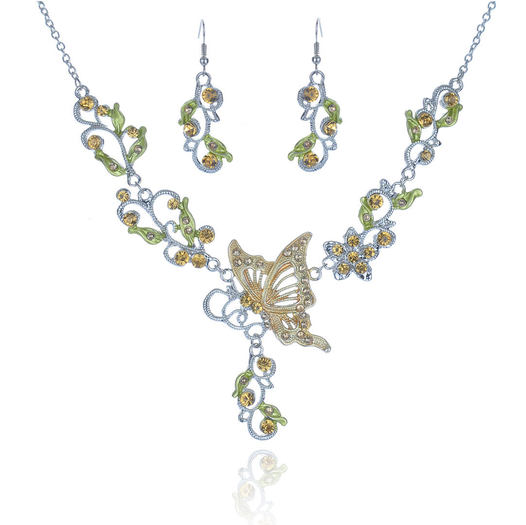 Butterfly-themed necklace and earrings set on a white background