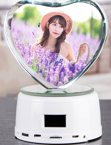 Heart-shaped mirror with a person in a lavender field on a white base