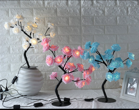 Decorative lamps with floral designs on a white textured wall background
