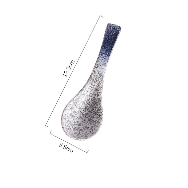 Gradient blue to gray ceramic spoon with measurements on a white background