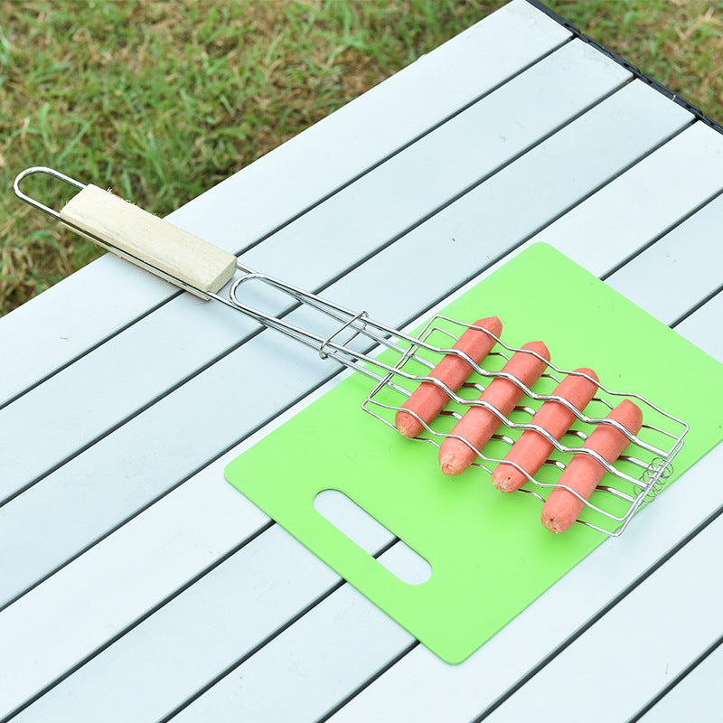 Hot dog grill on a green cutting board with sausages on a wooden surface