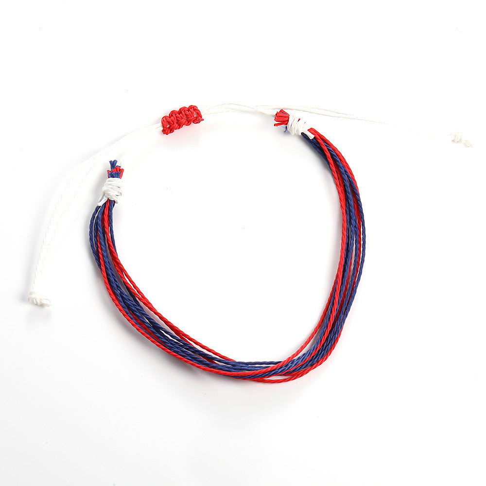 Necklace with red and blue cords on a white background