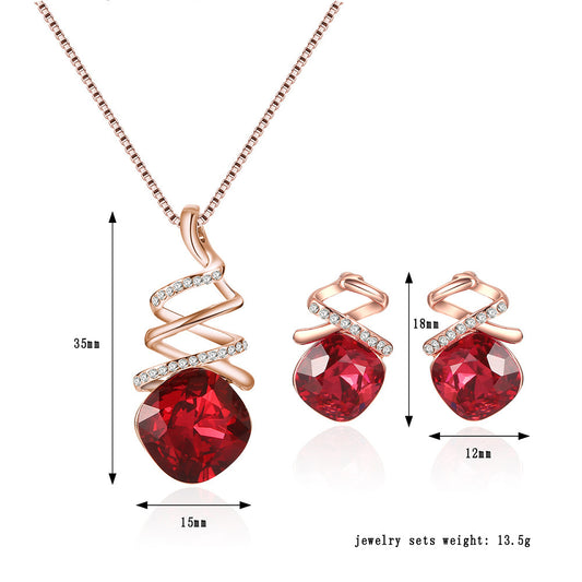 Jewelry set with red gemstones and rose gold accents, including necklace and earrings, with measurements on a white background.