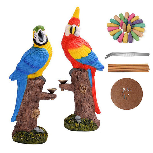 Decorative parrot statues with accessories on a white background