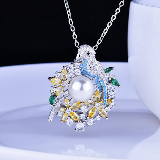 Jewelry pendant with pearl and gemstones on a white stand