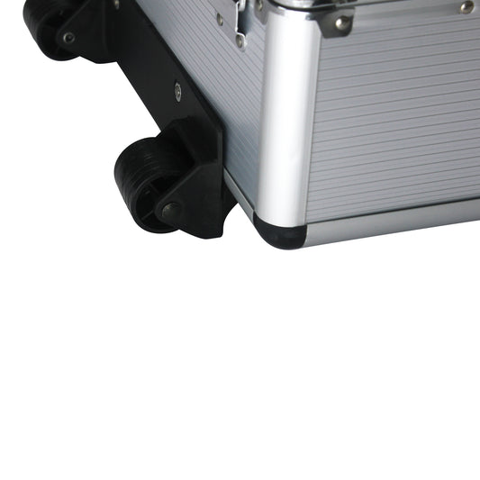 Close-up of a silver suitcase with a black wheel on a white background