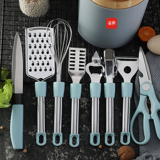 Set of kitchen utensils with blue handles on a dark surface