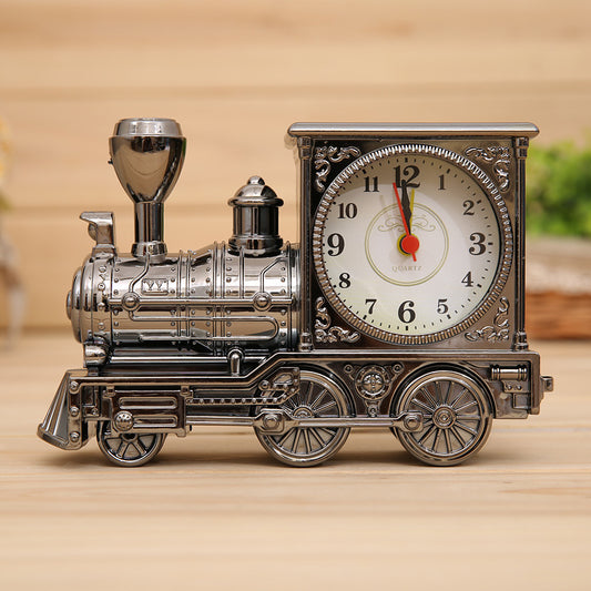 Vintage-style train clock on a wooden surface