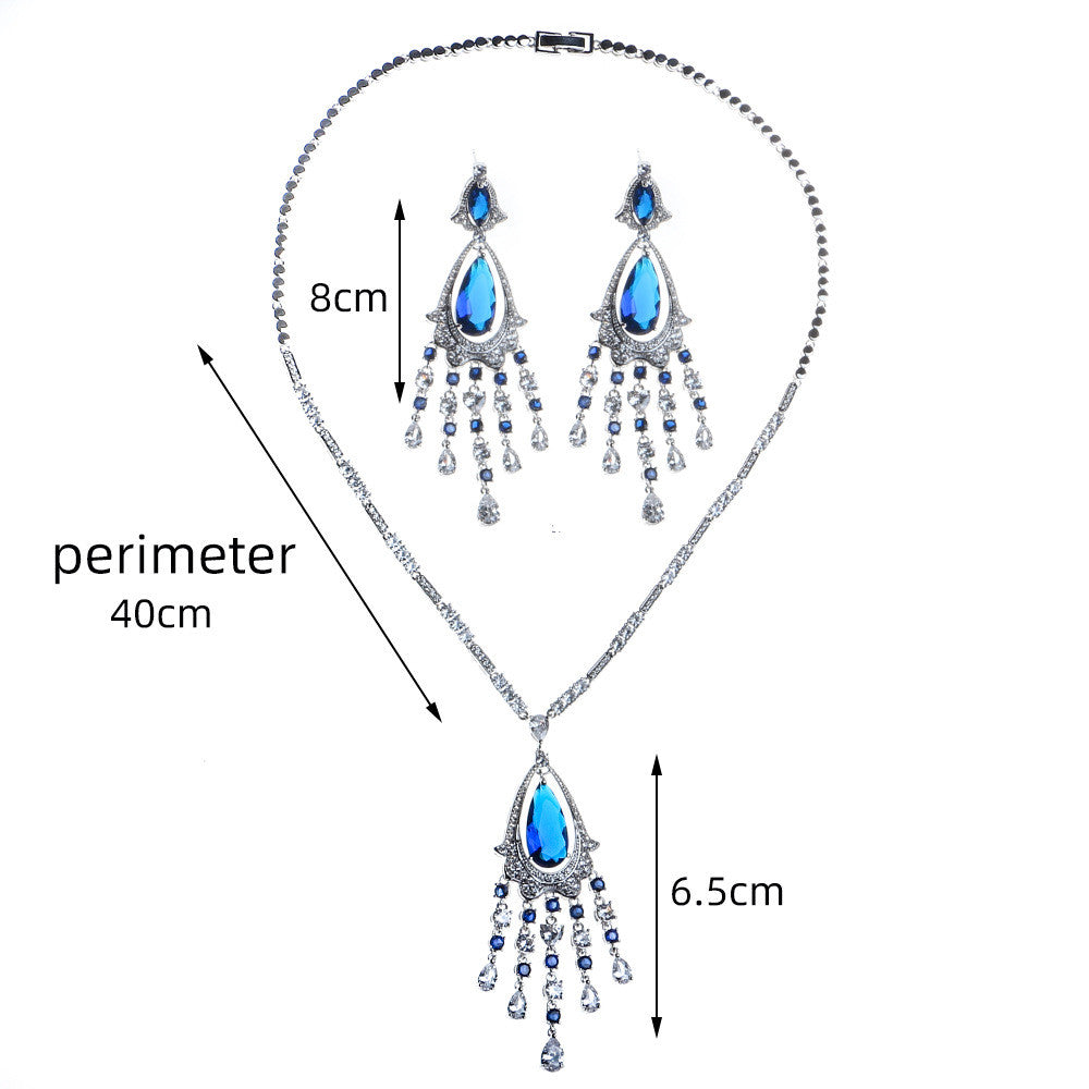 Jewelry set with necklace and earrings, showing measurements on a white background
