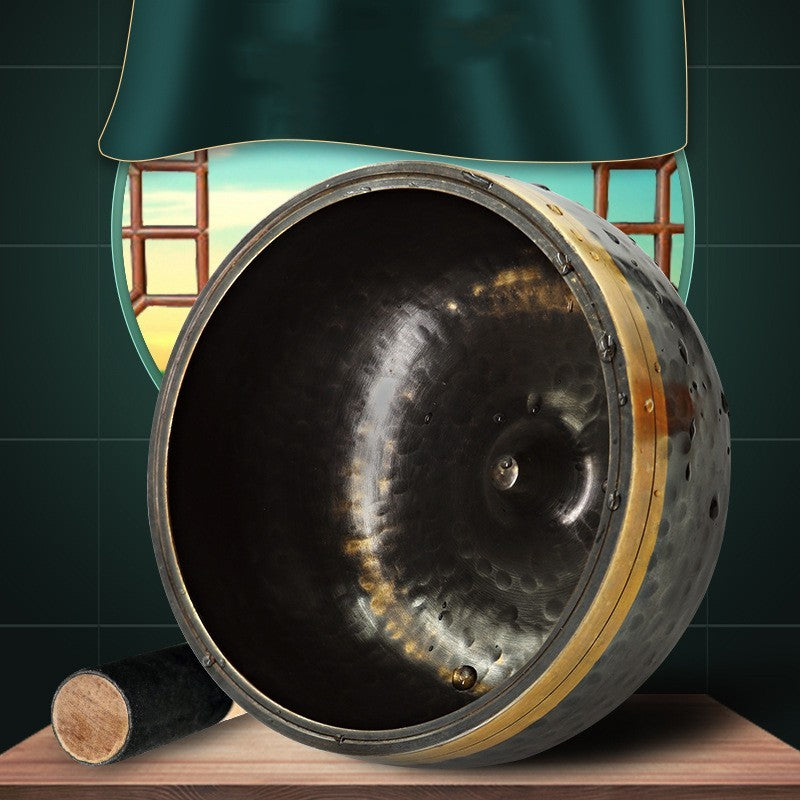 Close-up of a worn-out tire with a green lampshade in the background