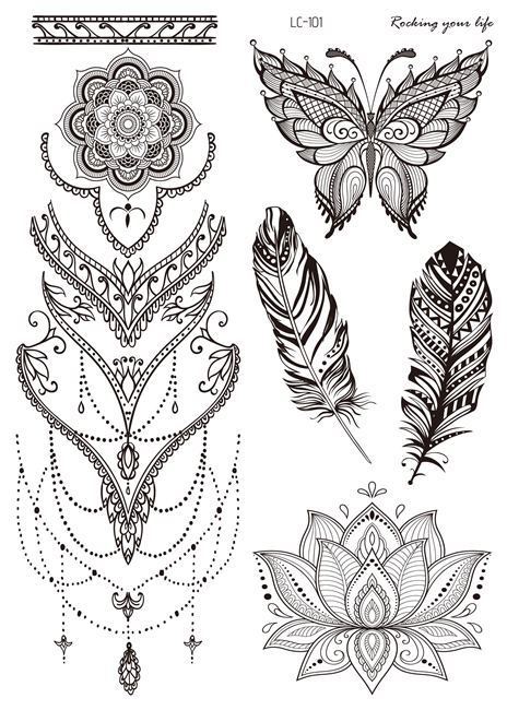Set of black and white temporary tattoos featuring floral, butterfly, and feather designs.
