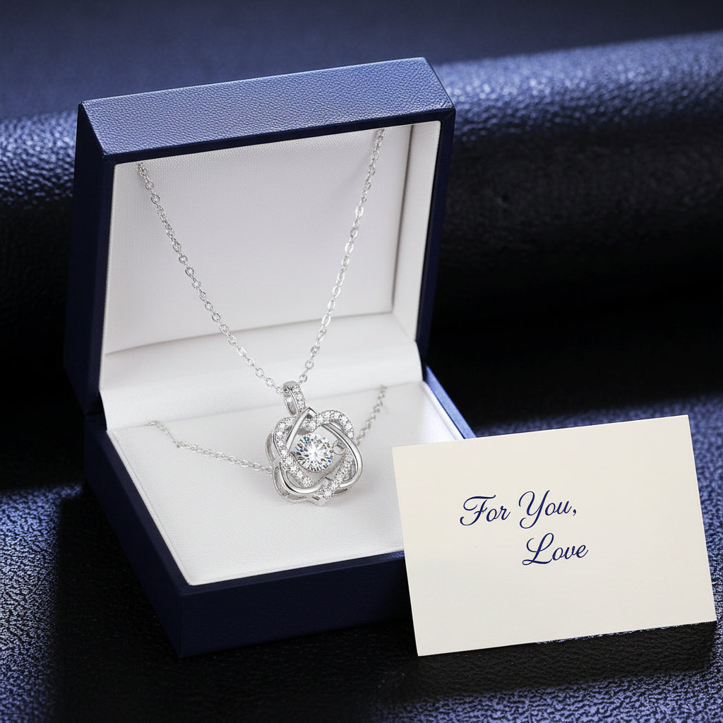 Silver necklace with a round pendant on a dark textured background
