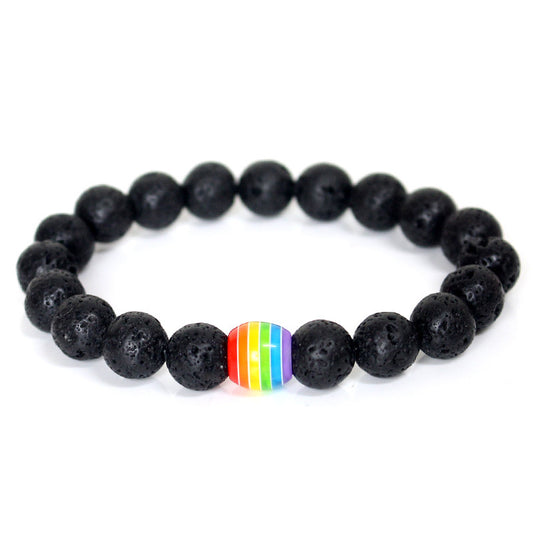 Black beaded bracelet with a rainbow heart charm on a white background