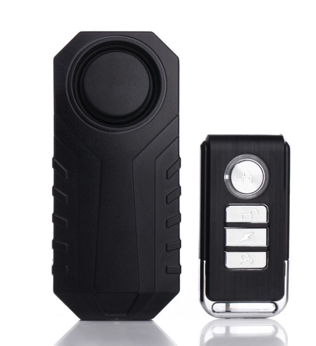 Black security alarm system with remote control on a white background