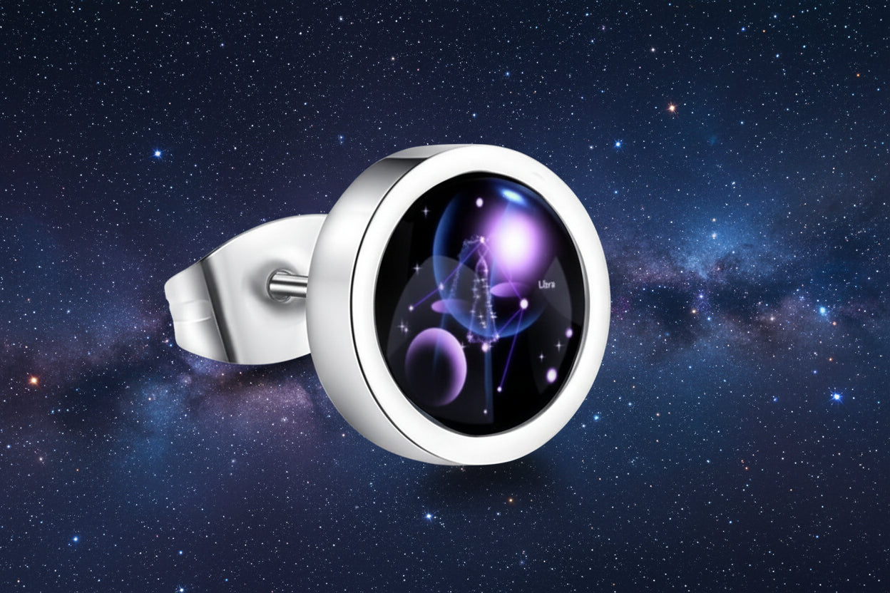 Silver ring with a black stone featuring celestial design on a white background from nested wisdom