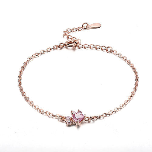 Rose gold bracelet with a pink gemstone on a white background