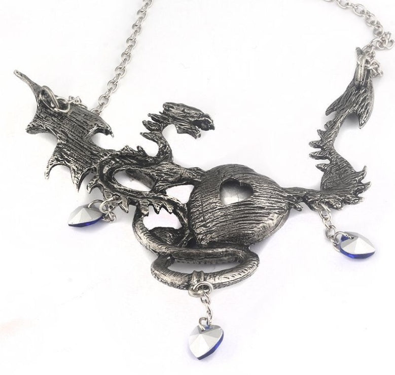 Silver necklace with a detailed dragon design on a white background