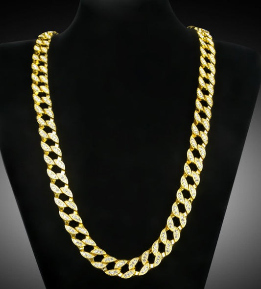 Gold chain necklace on a black mannequin
