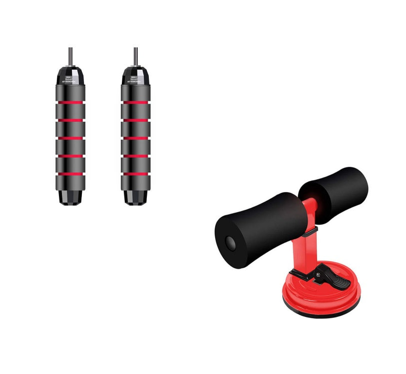 Black and red suction cup  sit up tool with two black handles on a white background