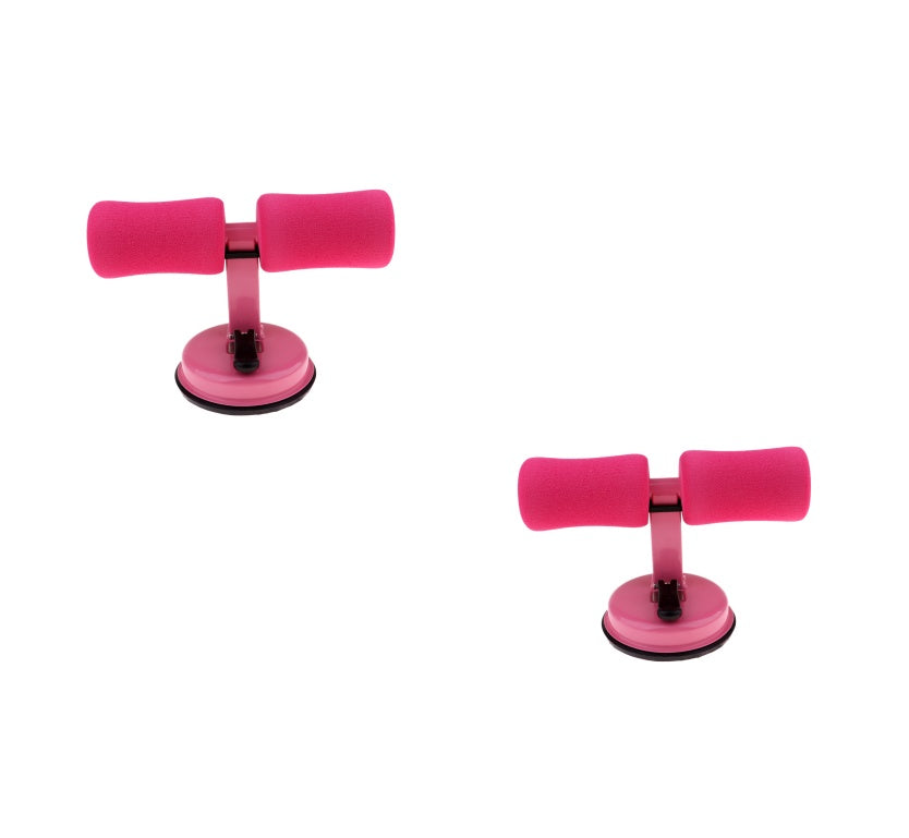 2 pink sit up exercisers on a white background
