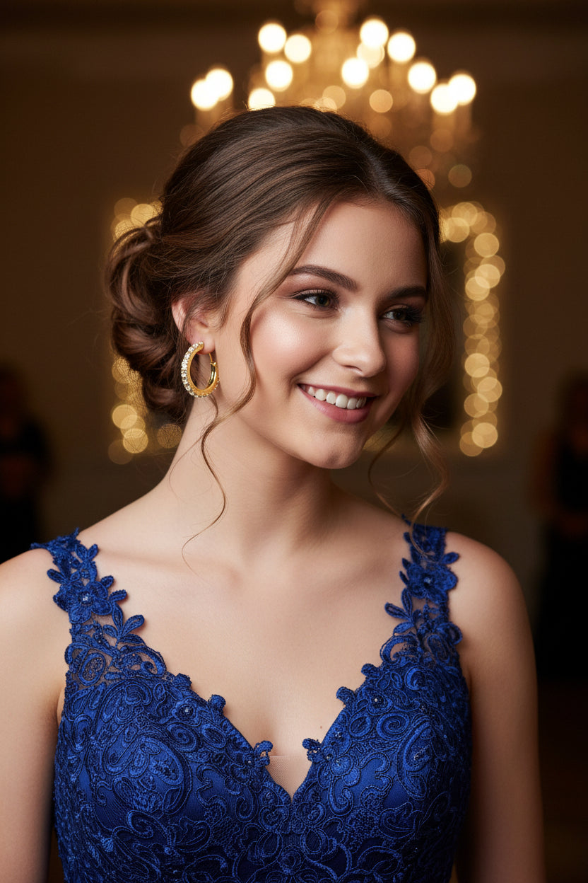 Gold hoop earring with embedded stones on woman in formal setting