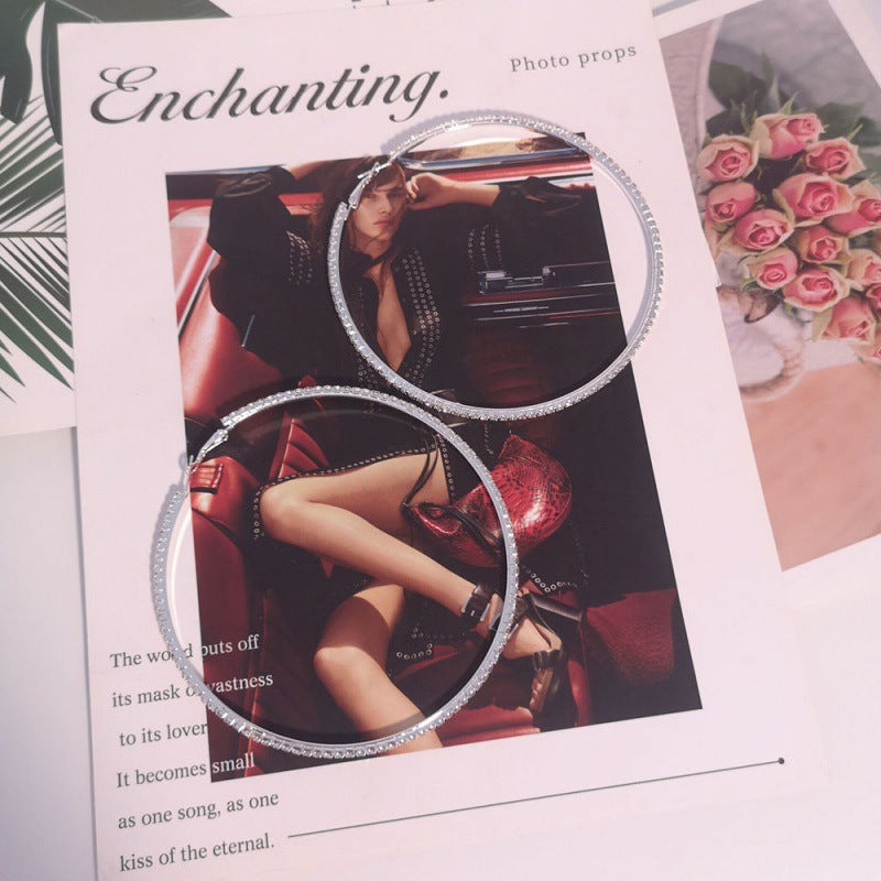 Promotional material for photo props with a model in a car and text overlay.