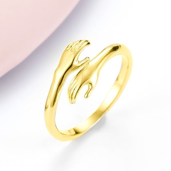 Gold ring with a unique design on a gradient background