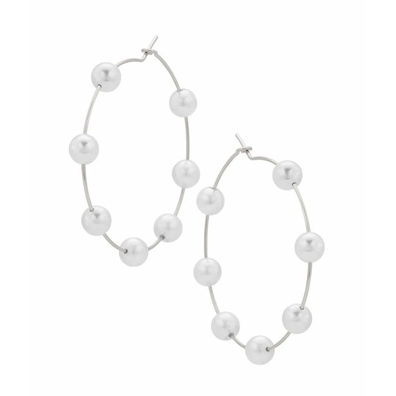 Pearl hoop earrings on a white background