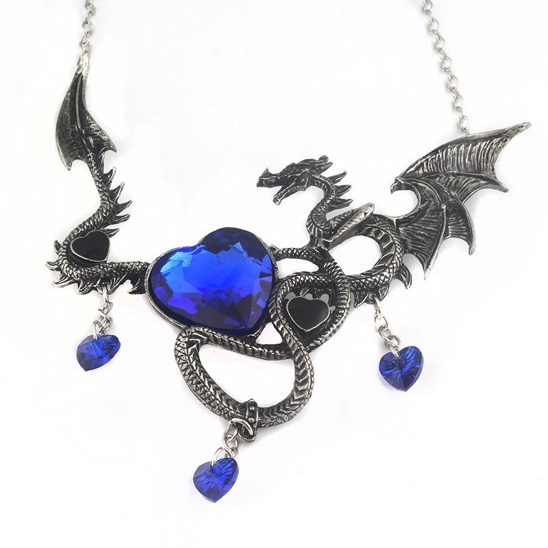 Dragon-shaped necklace with blue heart stones on a white background