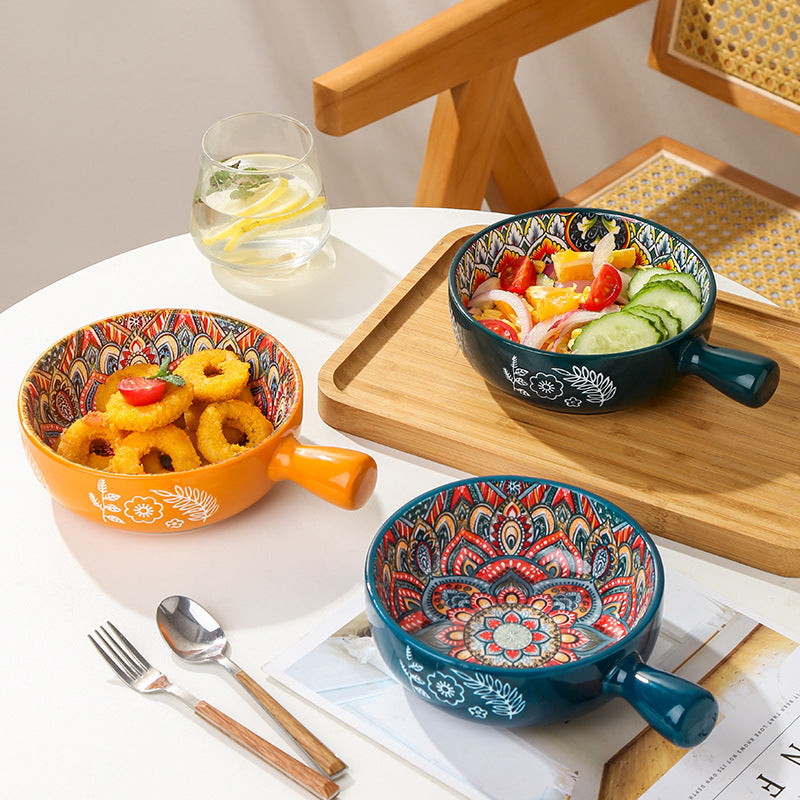 Colorful ceramic bowls with handles on a table with a glass of water and snacks. From Nested Wisdom