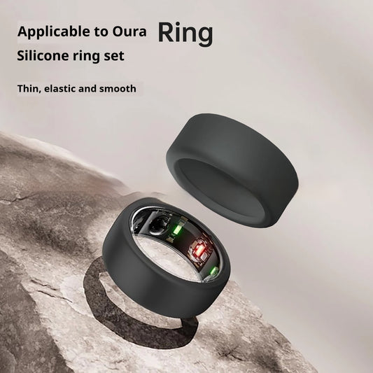 Black silicone ring set on a stone surface with text about compatibility and features.