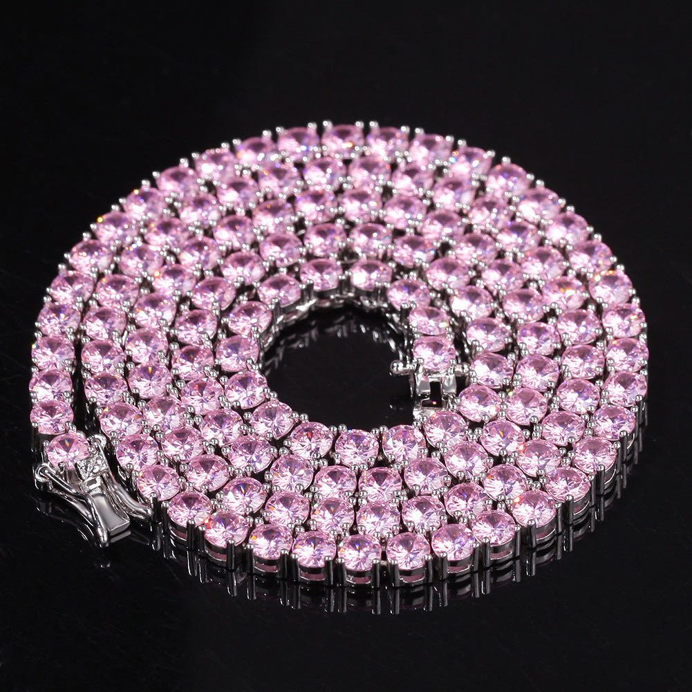 Pink diamond tennis necklace on a black background