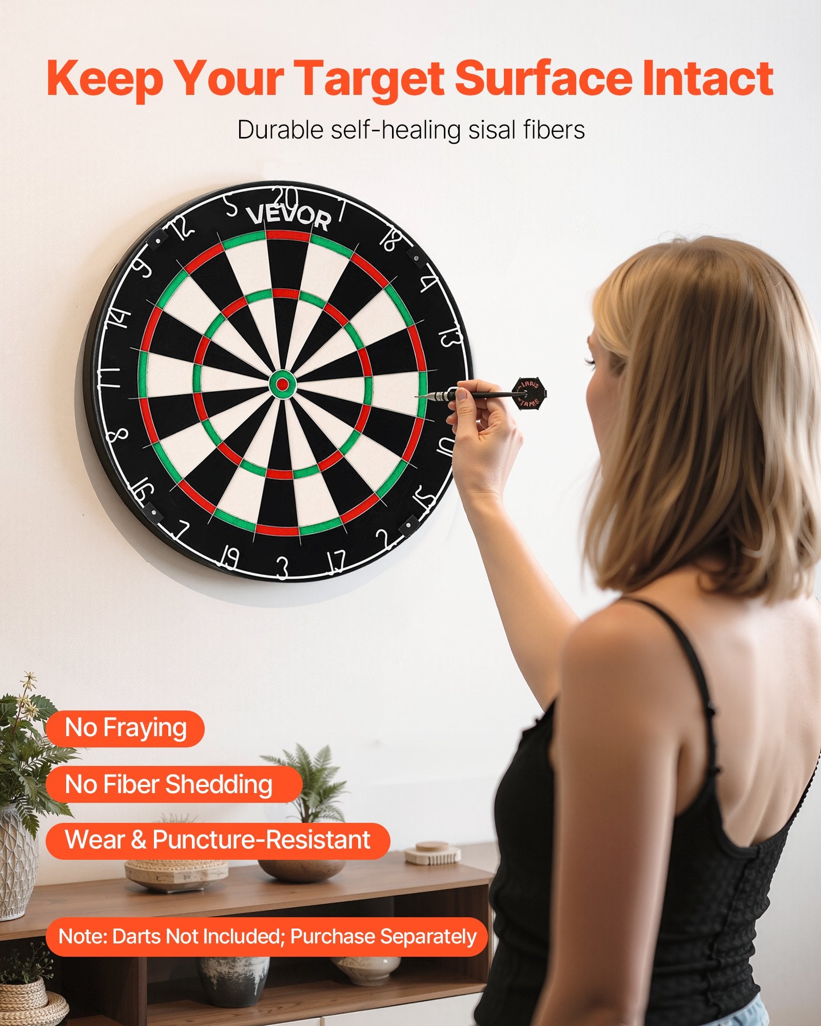 Woman playing darts with a VEVOR dartboard in a room setting from Nested Wisdom