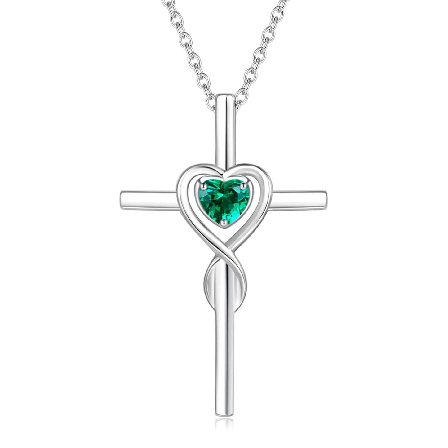 Birthstone  Silver cross pendant with a heart-shaped green gemstone on a white background