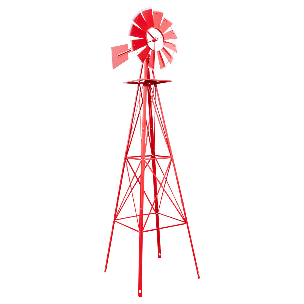 Red metal windmill on a white background