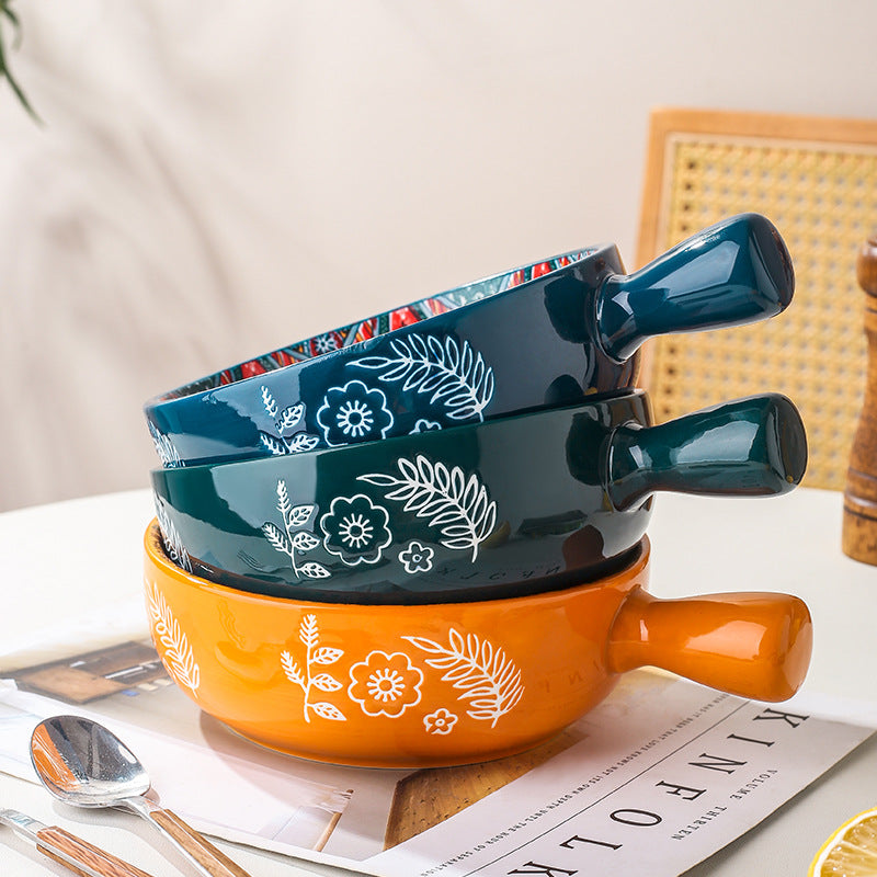 Set of two ceramic bowls with floral patterns on a table. From Nested Wisdom