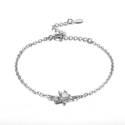 Silver bracelet with a butterfly clasp on a white background