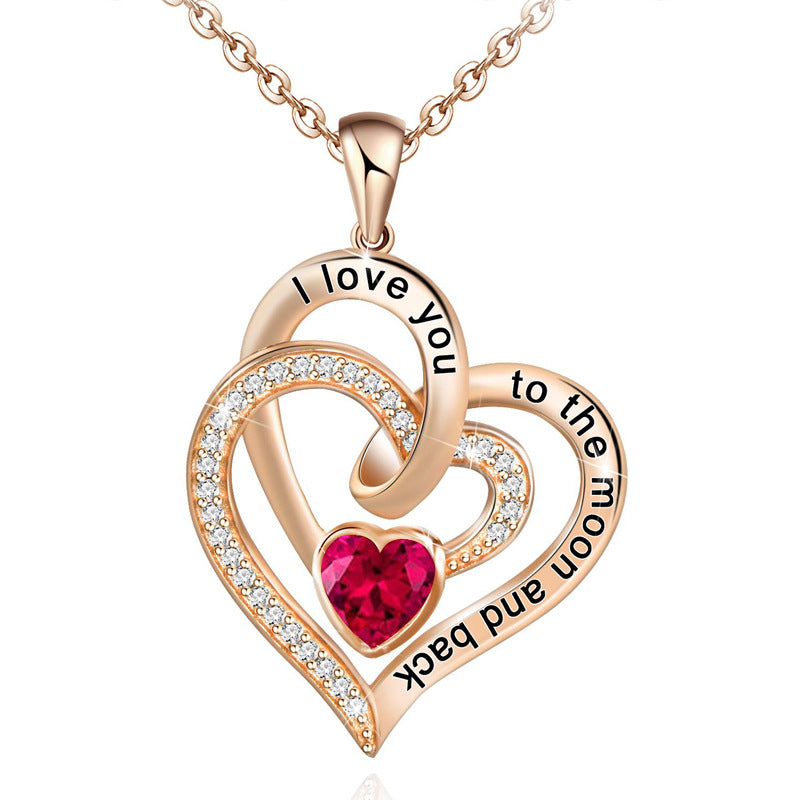 Birthstone Rose gold heart-shaped pendant with red gemstone and engraved text on a white background