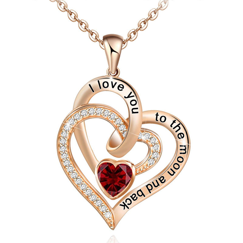 Birthstone Rose gold heart-shaped pendant with red gemstone and engraved text on a white background