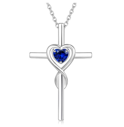 Birthstone  Necklace with a blue flower pendant and clear bead on a white background