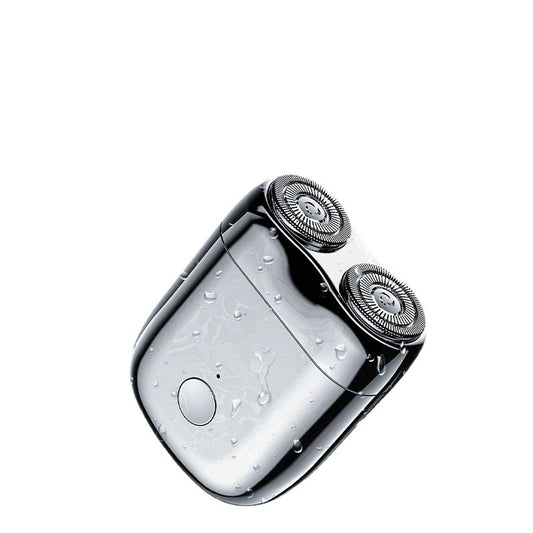 Chrome electric shaver on a white background