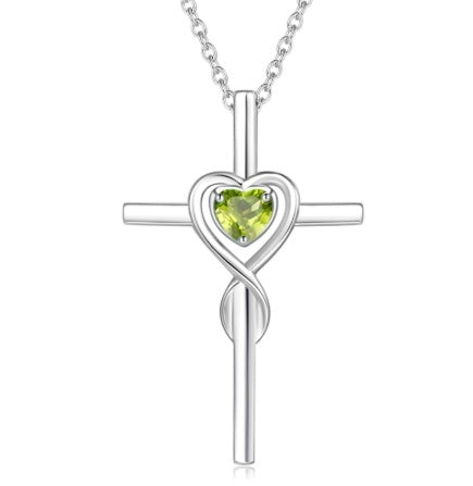 Birthstone  Silver cross pendant with heart-shaped green gemstone on a white background