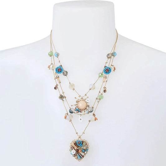 Multistrand necklace with heart pendant on a mannequin against a white background from Nested Wisdom